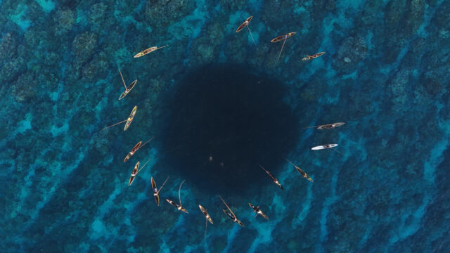 Ulawa Island Circle of Fishermens Canoe catching fish in a school of fish Su umoli Village