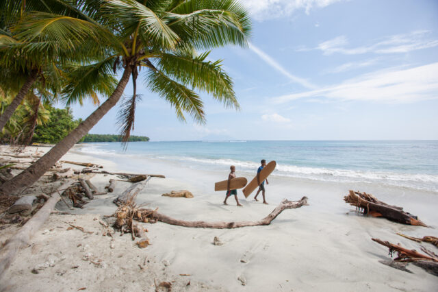 Bogia District local surfers surfing on timber boards is a longstanding tradition with locals crafting their own surfboards from local materials Madang Province 2016. Papua New Guinea.